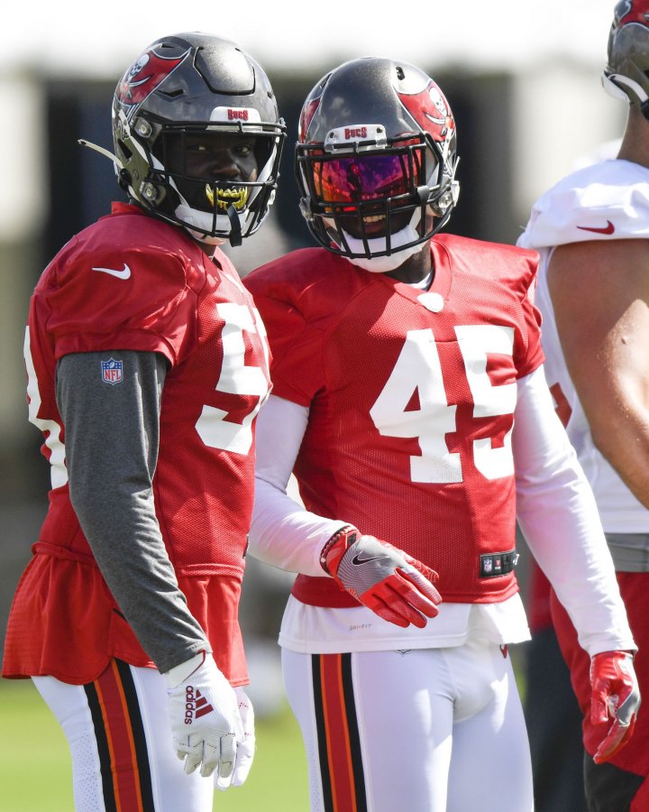 Shaquil Barrett #58 and Devin White #45 of the Tampa Bay Buccaneers looks on during training camp at Raymond James Stadium on September 08, 2020 in Tampa, Florida.
