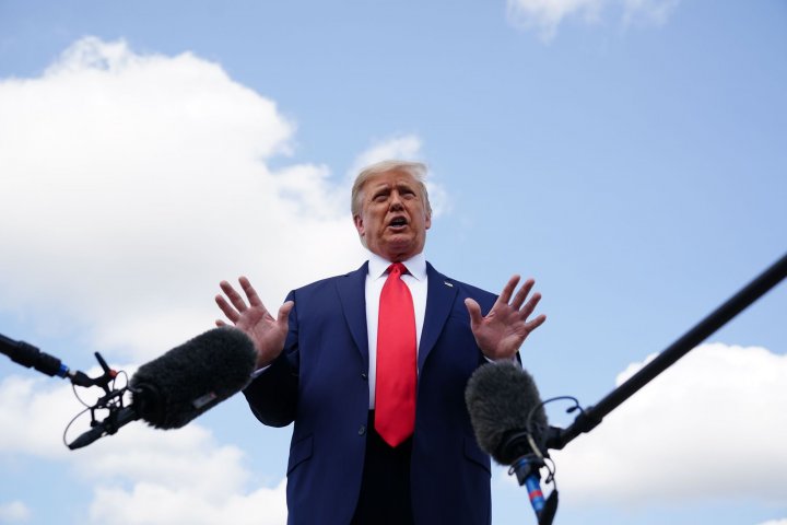 US President Donald Trump speaks as he makes his way to board Air Force One before departing from Andrews Air Force Base in Maryland on September 8, 2020.