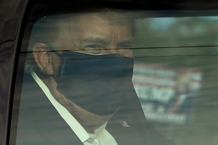 U.S. President Donald Trump wears a protective face mask in a motorcade outside Walter Reed Medical Center during his treatment of COVID-19 in Bethesda, Maryland on October 4, 2020. Photo by Yuri Gripas/ABACAPRESS.COM *